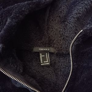 Medium fuzzy black crop top sweater im a small and it fits perfect worn it once